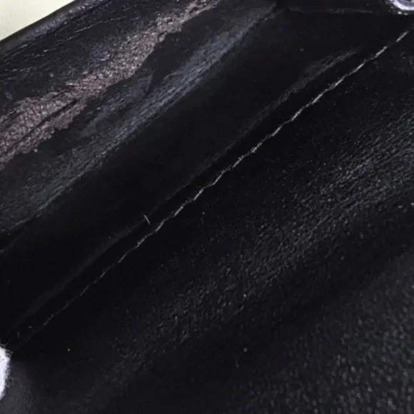 Beautiful wallet only damaged in the coin pocket can see the rest